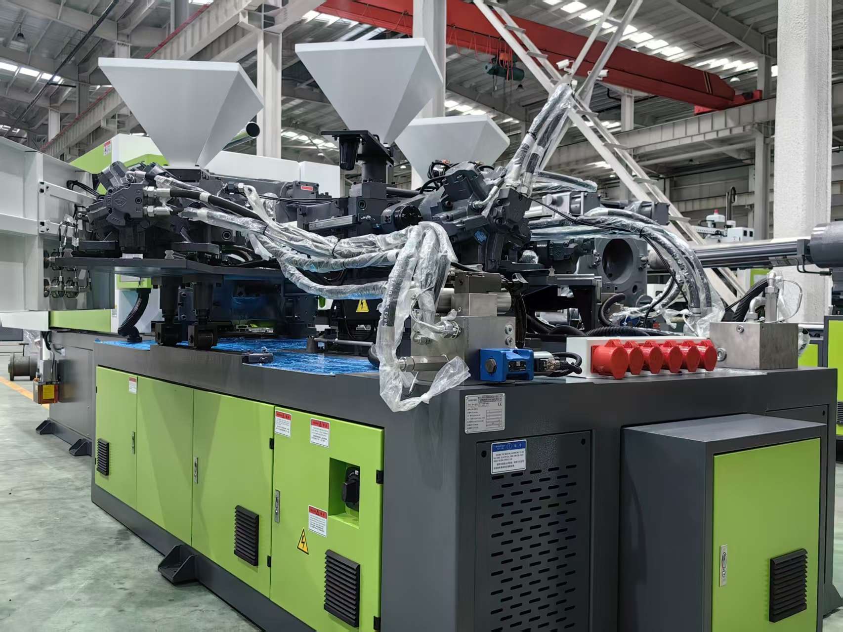 Three Shot Injection Molding Process Diagram showing the three-shot injection molding process.